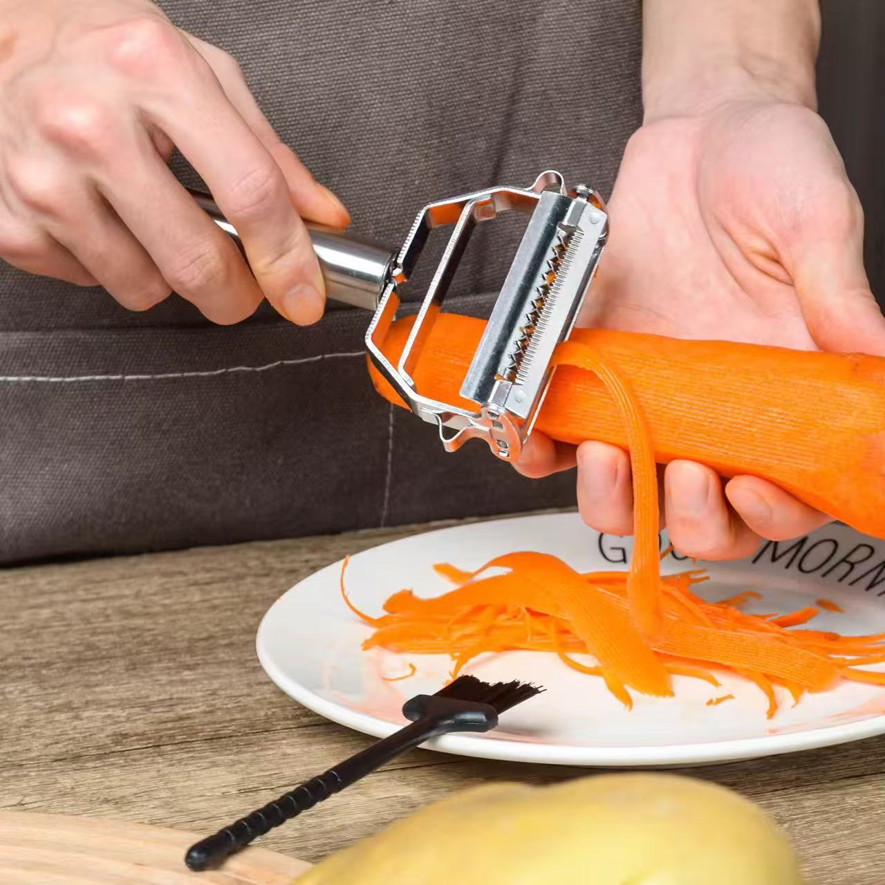 Two-in-one stainless steel peeler and shredder